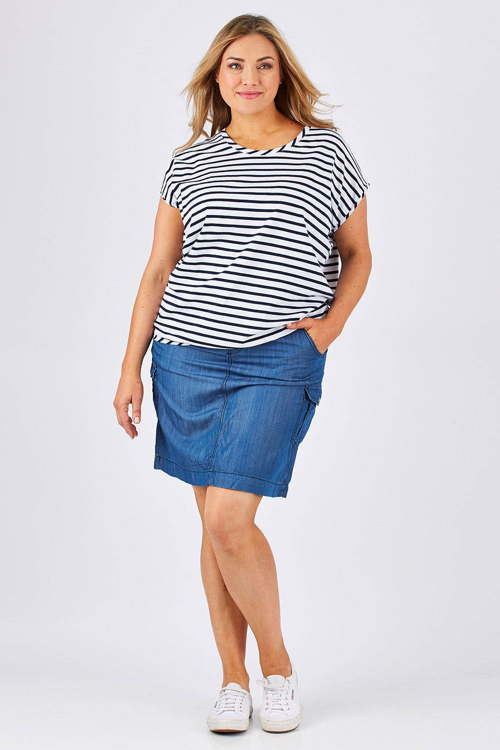 Model Ljubenka wearing size 18 of The Drape Tee in colour NavyStripe (Blue), from the front, showing the whole outfit