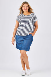 Model Ljubenka wearing size 18 of The Drape Tee in colour NavyStripe (Blue), from the front, showing the whole outfit