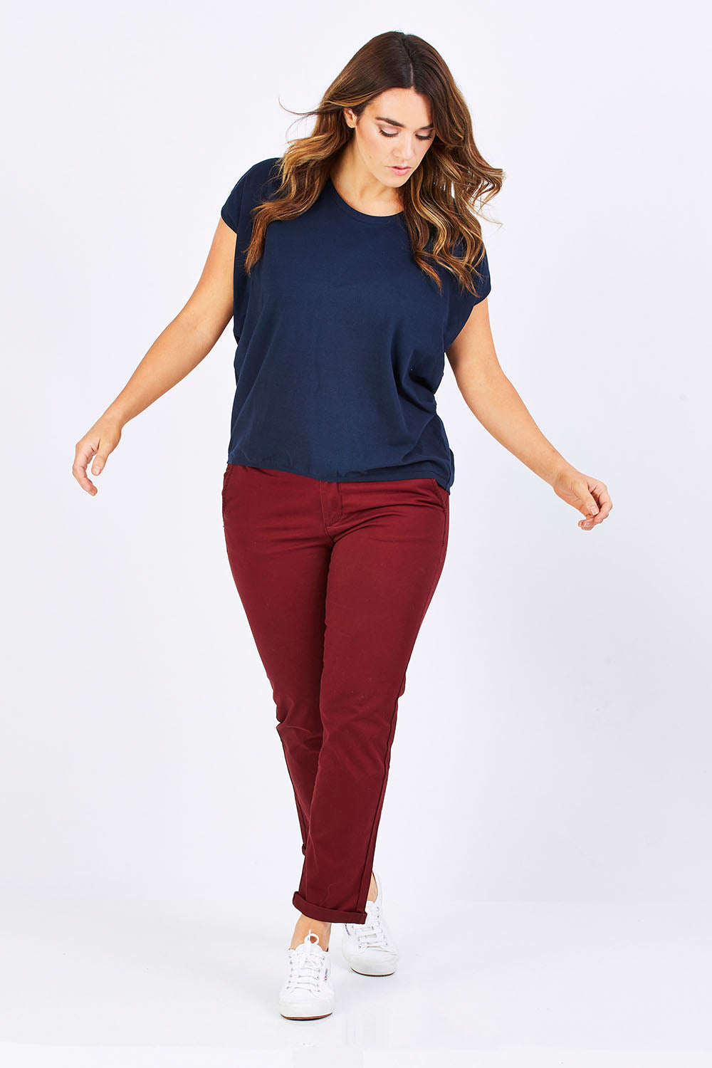 Model Laura wearing size 12 of The Drape Tee in colour Navy (Blue), from the front, showing the whole outfit