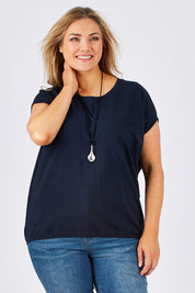 Model Ljubenka wearing size 18 of The Drape Tee in colour Navy (Blue), from the front, cropped image