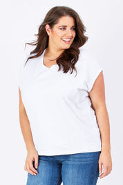 Model Mae wearing size 16 of The Drape Tee in colour White (White), from the front, cropped image