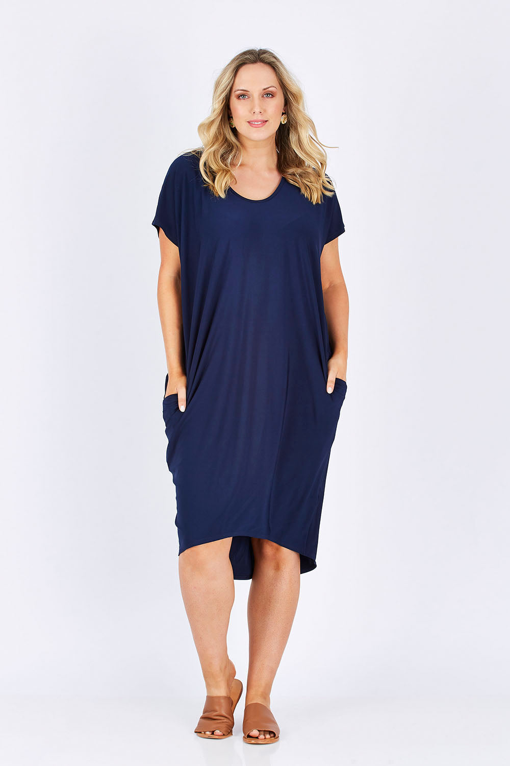 Model Jess wearing size 14 of The Drape Jersey Dress in colour Navy (Blue), from the front, showing the whole outfit
