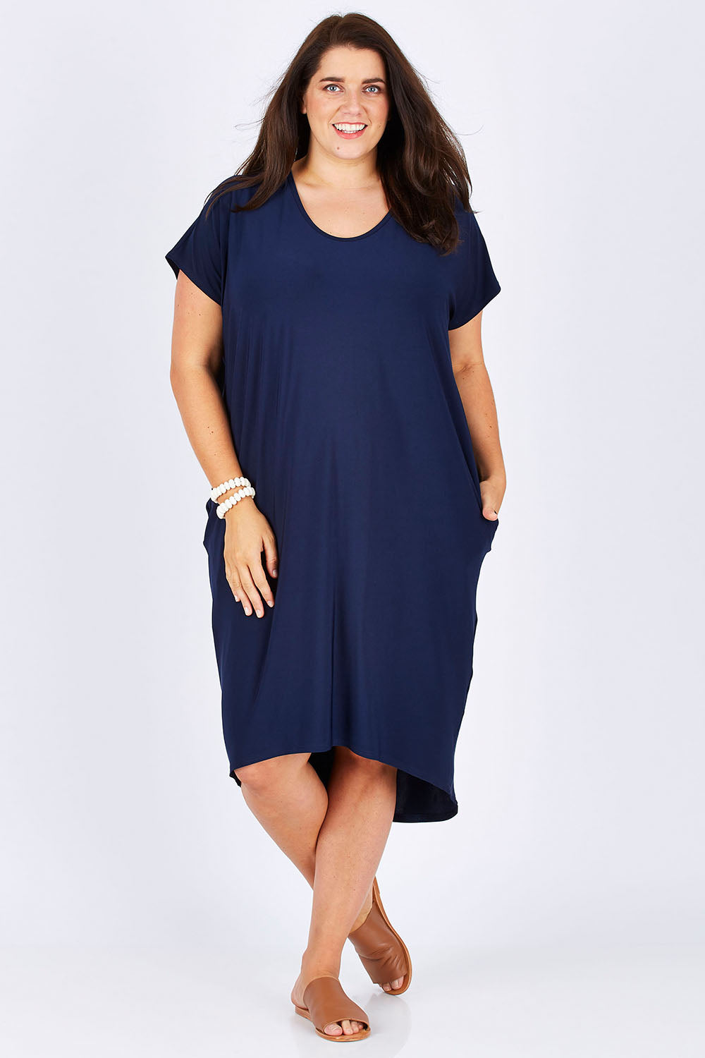 Model Mae wearing size 18 of The Drape Jersey Dress in colour Navy (Blue), from the front, showing the whole outfit