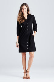 Model Anna wearing size 10 of The Cotton Shirt Dress in colour Black (Black), from the front, showing the whole outfit
