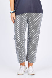 Model Jess wearing size 14 of The Stretch Spot Pant in colour Navy (Blue), from the front, cropped image