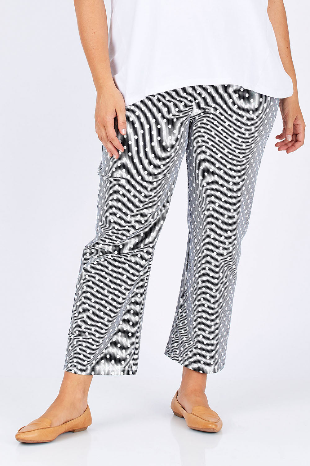 Model Mae wearing size 18 of The Stretch Spot Pant in colour Navy (Blue), from the front, cropped image