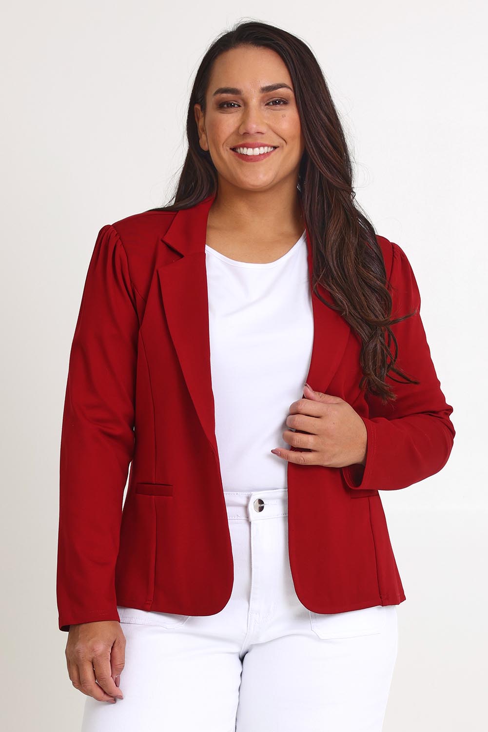 Model Ashleigh wearing size 16 of The Ponte Blazer in colour Brick (Red), from the front, cropped image