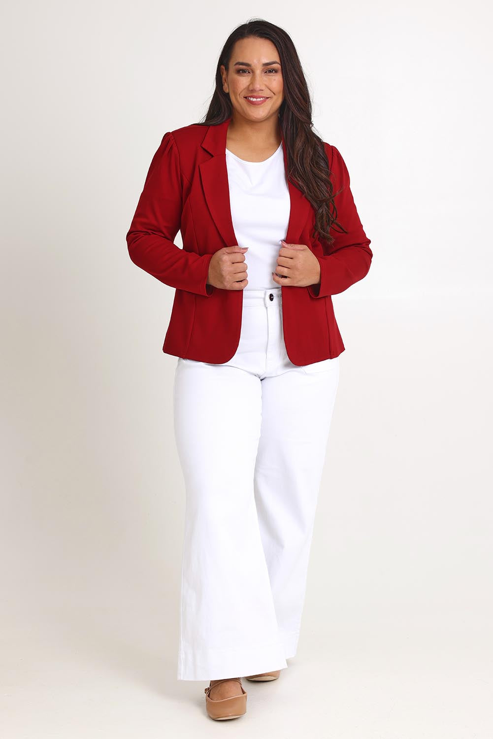 Model Ashleigh wearing size 16 of The Ponte Blazer in colour Brick (Red), from the front, showing the whole outfit