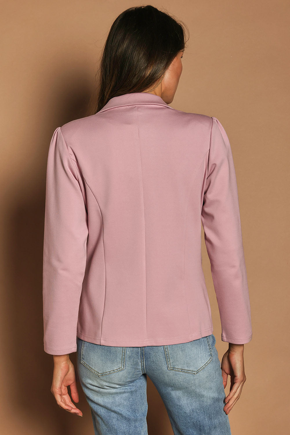 Model Madeline wearing size 10 of The Ponte Blazer in colour Dustypink (Pink), from the back