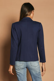 Model Madeline wearing size 10 of The Ponte Blazer in colour Navy (Blue), from the back