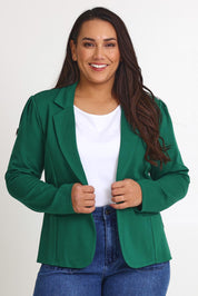 Model Ashleigh wearing size 16 of The Ponte Blazer in colour Pinegreen (Green), from the front, cropped image
