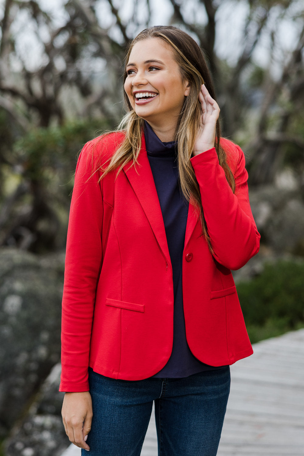 Model Tahlia wearing size 10 of The Ponte Blazer in colour Red (Red), from the front, showing the whole outfit