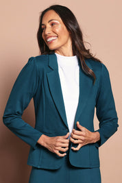 Model Amanda wearing size 10 of The Ponte Blazer in colour Teal (Blue), from the front, cropped image