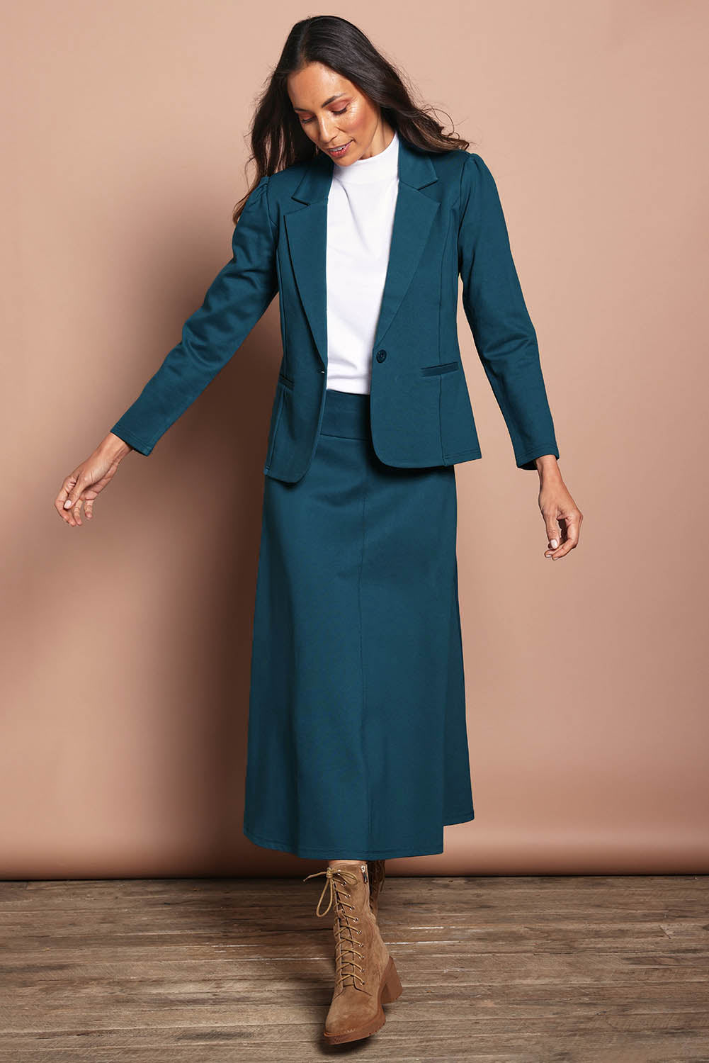 Model Edith wearing size 10 of The Ponte Blazer in colour Teal (Blue), from the front, showing the whole outfit