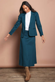 Model Edith wearing size 10 of The Ponte Blazer in colour Teal (Blue), from the front, showing the whole outfit