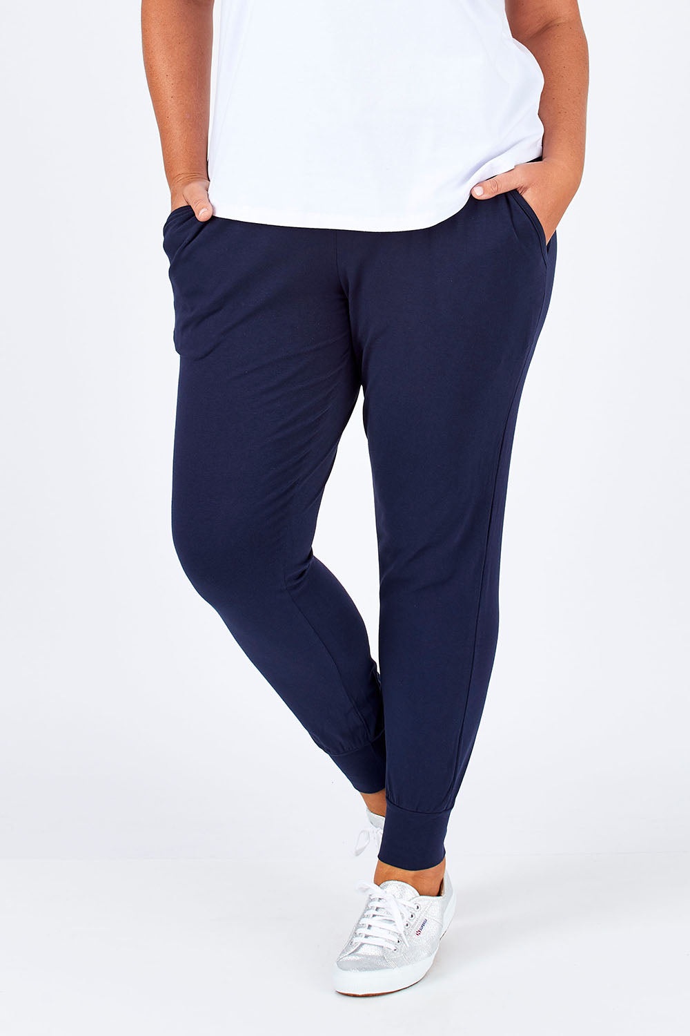 Model Fiona wearing size 16 of The Basic Keeper Pant in colour Ink (Blue), from the front, cropped image