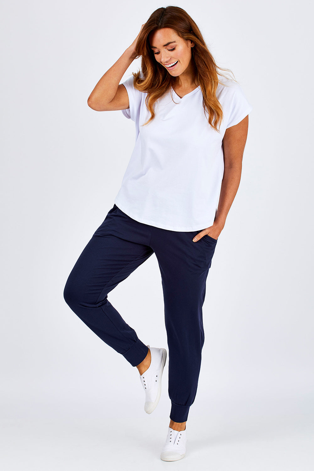 Model Laura wearing size 12 of The Basic Keeper Pant in colour Ink (Blue), from the front, showing the whole outfit