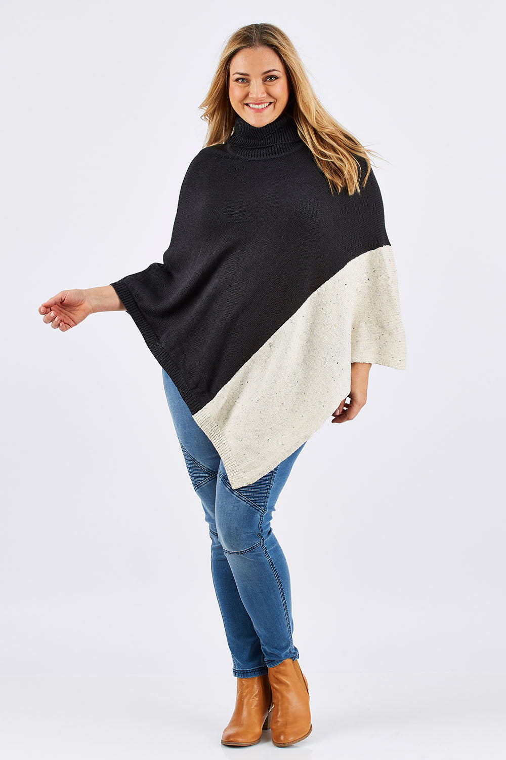Model Ljubenka wearing The Panel Knit Poncho in colour Charcoal (Black), from the front, showing the whole outfit