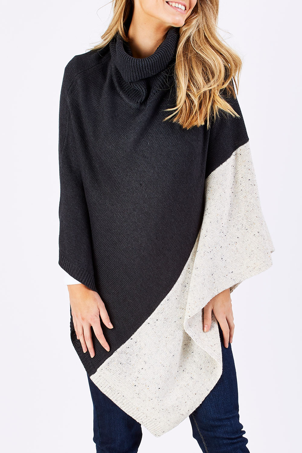 Model Marnee wearing The Panel Knit Poncho in colour Charcoal (Black), from the front, cropped image