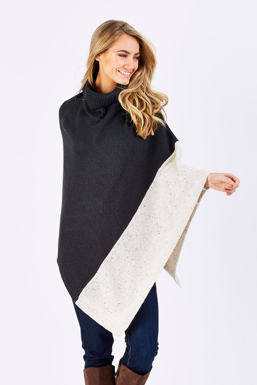 Model Marnee wearing The Panel Knit Poncho in colour Charcoal (Black), from the front, cropped image