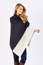 Model Marnee wearing The Panel Knit Poncho in colour Charcoal (Black), from the front, cropped image