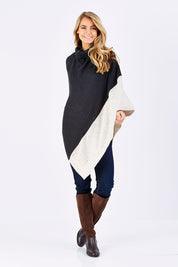 Model Marnee wearing The Panel Knit Poncho in colour Charcoal (Black), from the front, showing the whole outfit