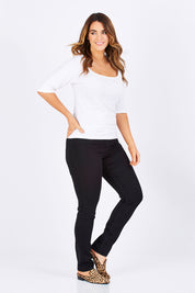 Model Laura wearing size 12 of The Slim Leg Powerstretch Jean in colour Black (Black), from the front, showing the whole outfit