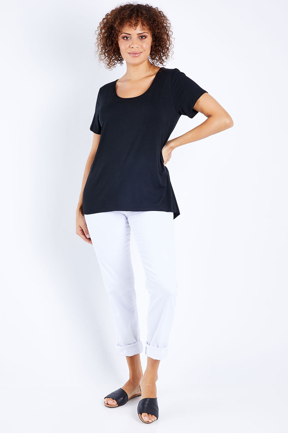 Model Lala wearing size 10 of The Round Neck Bamboo Tee in colour Black (Black), from the front, showing the whole outfit