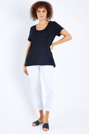 Model Lala wearing size 10 of The Round Neck Bamboo Tee in colour Black (Black), from the front, showing the whole outfit
