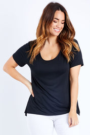 Model Laura wearing size 14 of The Round Neck Bamboo Tee in colour Black (Black), from the front, cropped image