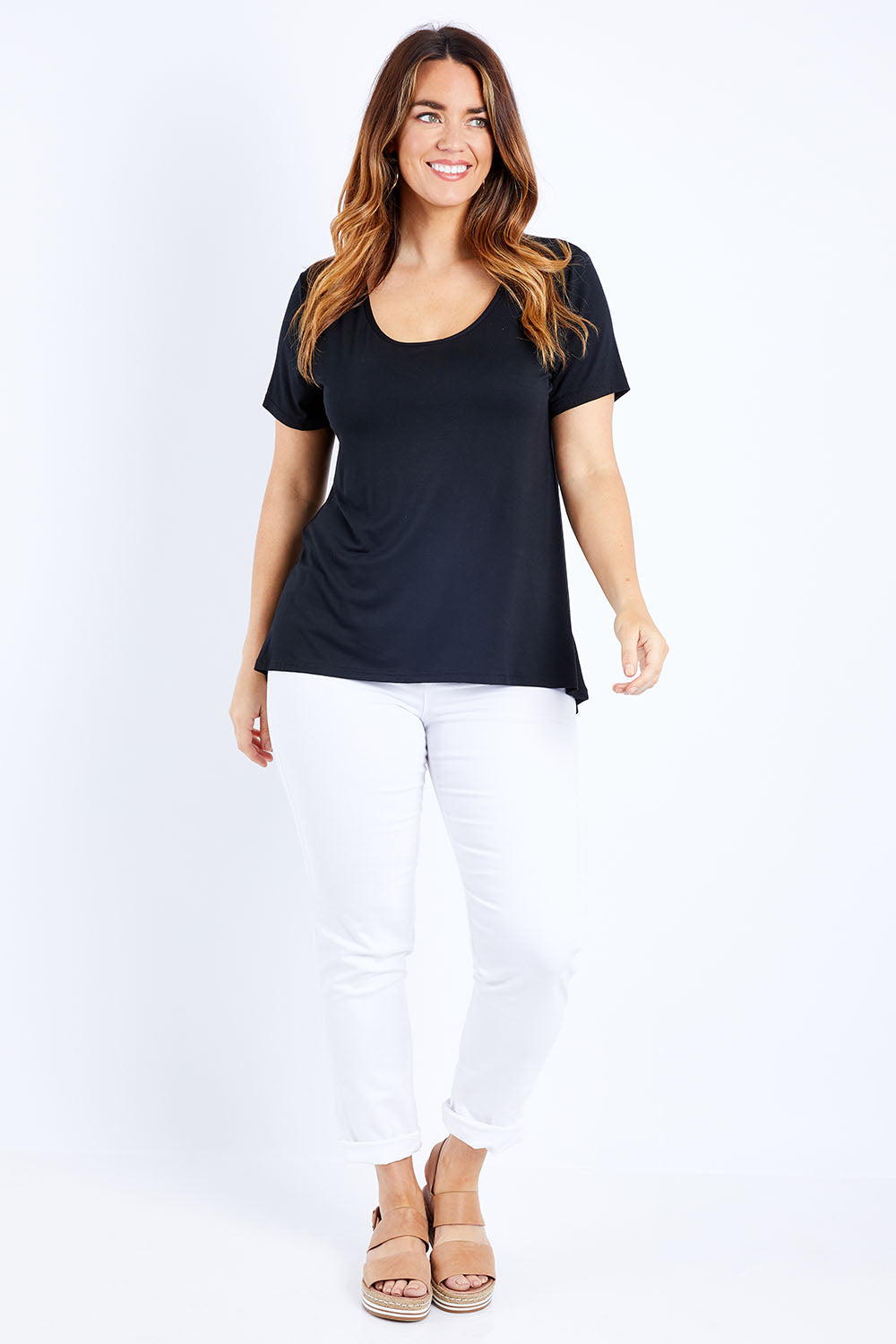 Model Laura wearing size 14 of The Round Neck Bamboo Tee in colour Black (Black), from the front, showing the whole outfit
