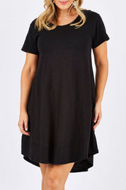 Model Jess wearing size 12 of The Swing Dress in colour Black (Black), from the front, cropped image