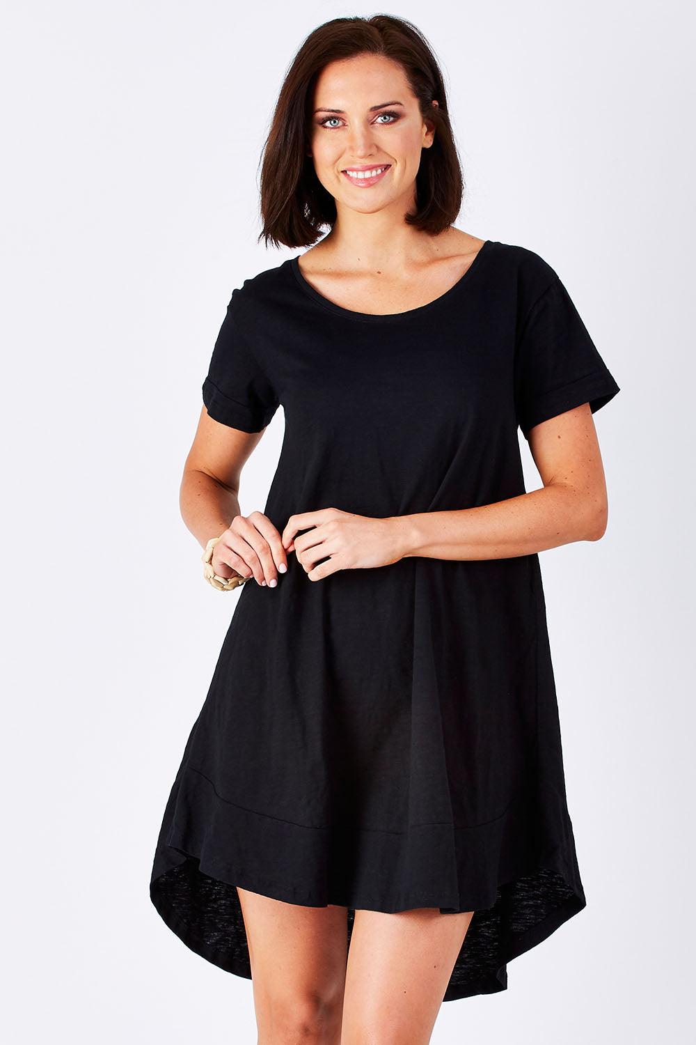 Model Perrie wearing size 10 of The Swing Dress in colour Black (Black), from the front, cropped image