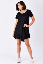 Model Perrie wearing size 10 of The Swing Dress in colour Black (Black), from the front, showing the whole outfit