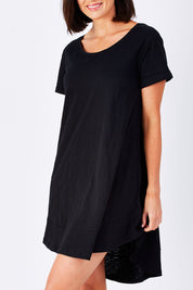 Model Perrie wearing size 10 of The Swing Dress in colour Black (Black), from the front, showing the whole outfit