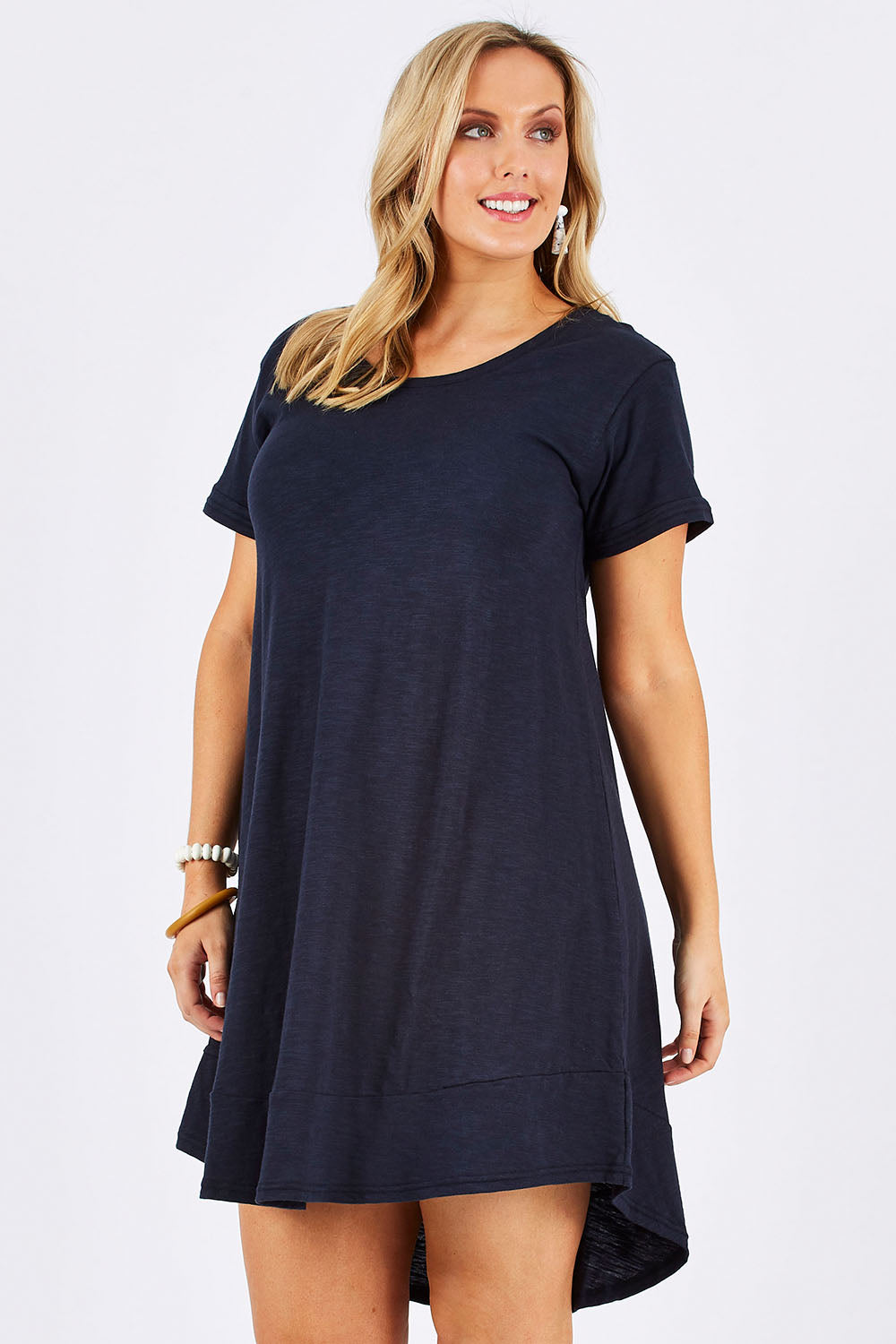 Model Jess wearing size 12 of The Swing Dress in colour Navy (Blue), from the front, cropped image