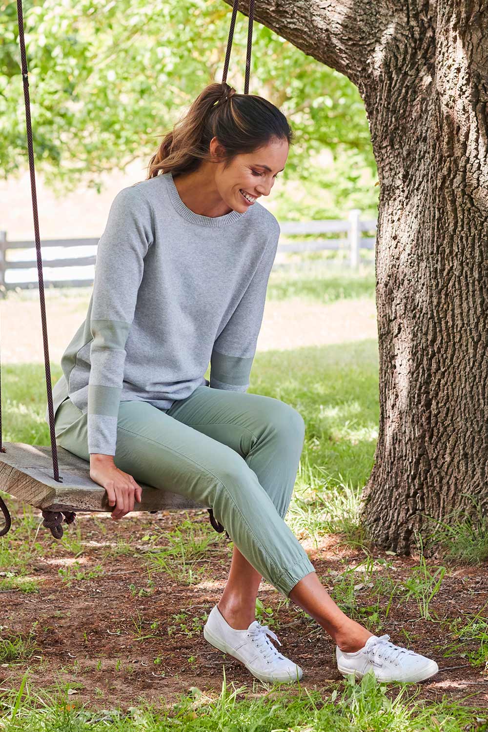 Model Amanda wearing size 10 of The Weekender Pant in colour Khaki (Green), from the front, showing the whole outfit