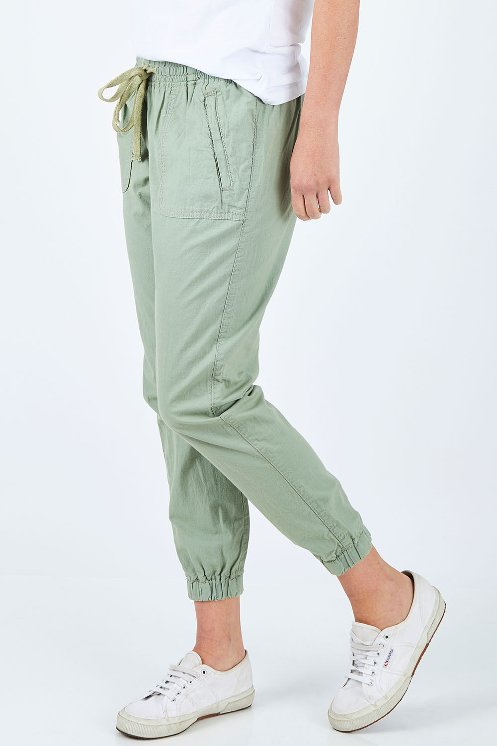 Model Chelsea wearing size 10 of The Weekender Pant in colour Khaki (Green), from the front, cropped image