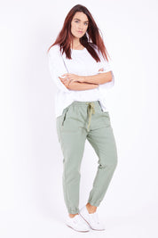 Model Laura wearing size 14 of The Weekender Pant in colour Khaki (Green), from the front, showing the whole outfit
