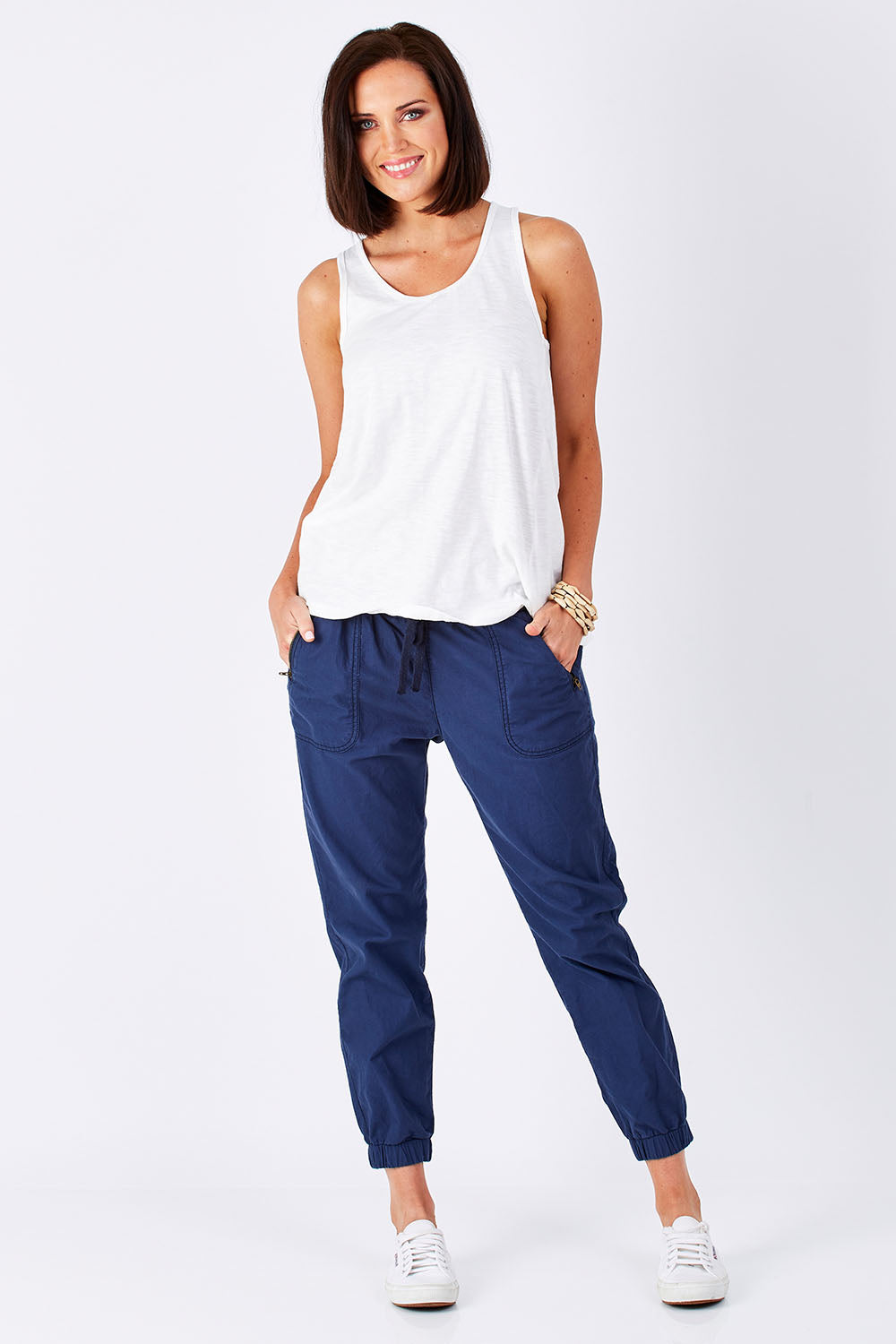 Model Perrie wearing size 10 of The Weekender Pant in colour Navy (Blue), from the front, showing the whole outfit