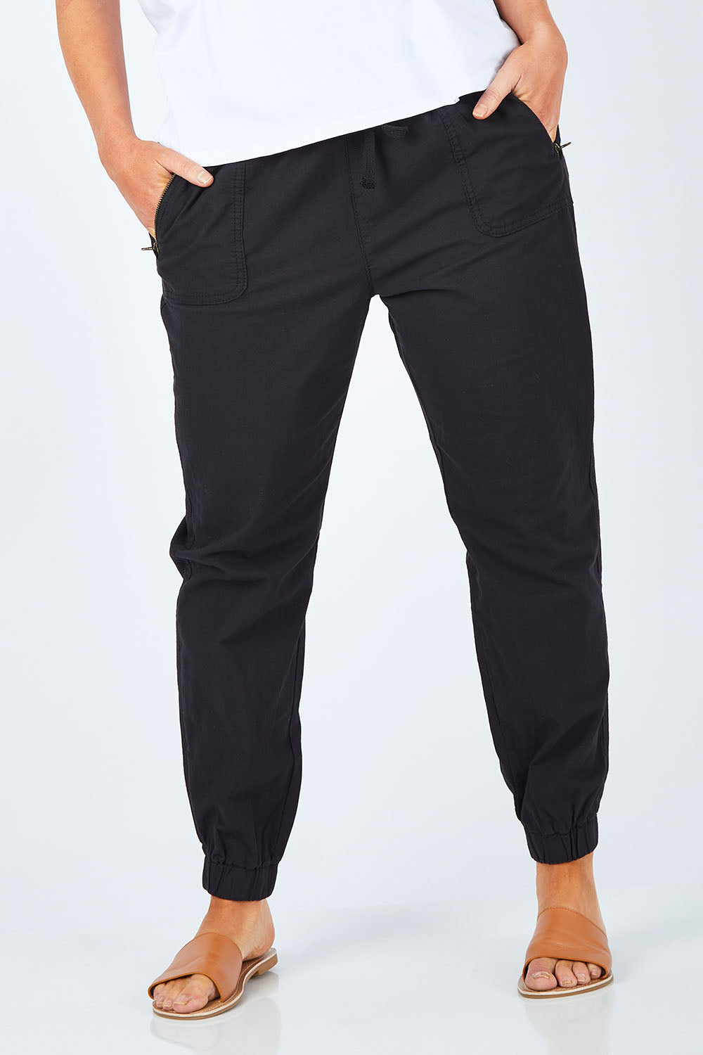 Model Laura wearing size 14 of The Weekender Pant in colour WashedBlac (Black), from the front, cropped image