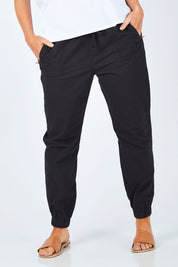 Model Laura wearing size 14 of The Weekender Pant in colour WashedBlac (Black), from the front, cropped image