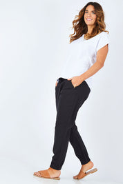 Model Laura wearing size 14 of The Weekender Pant in colour WashedBlac (Black), from the front, showing the whole outfit
