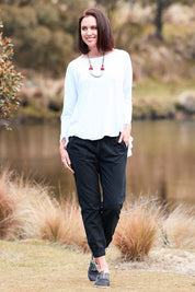Model Perrie wearing size 10 of The Weekender Pant in colour WashedBlac (Black), from the front, showing the whole outfit