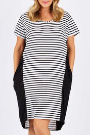 Model Jess wearing size 12 of The Contrast Panel Dress in colour Blkstripe (Black), from the front, cropped image
