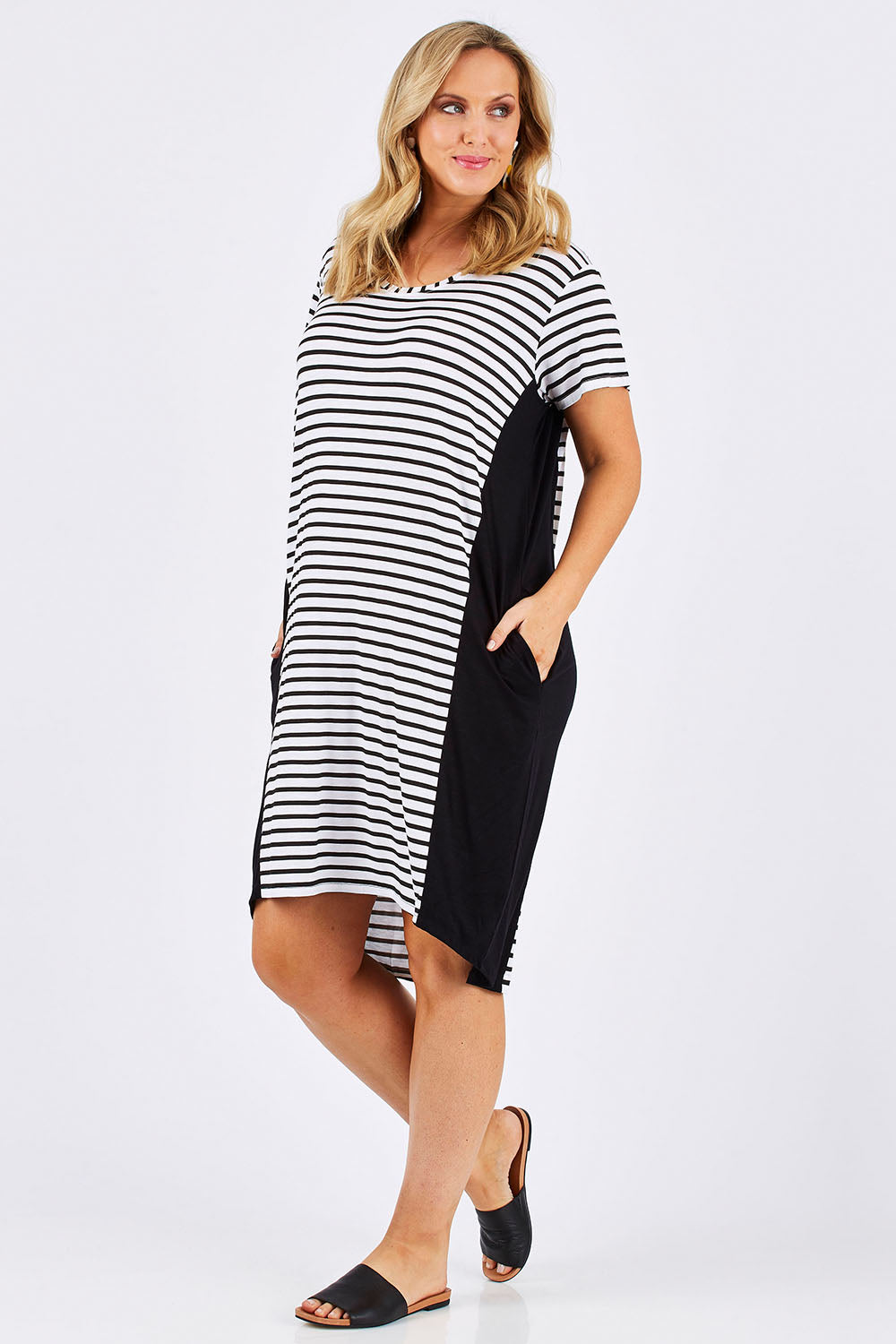 Model Jess wearing size 12 of The Contrast Panel Dress in colour Blkstripe (Black), from the front, showing the whole outfit