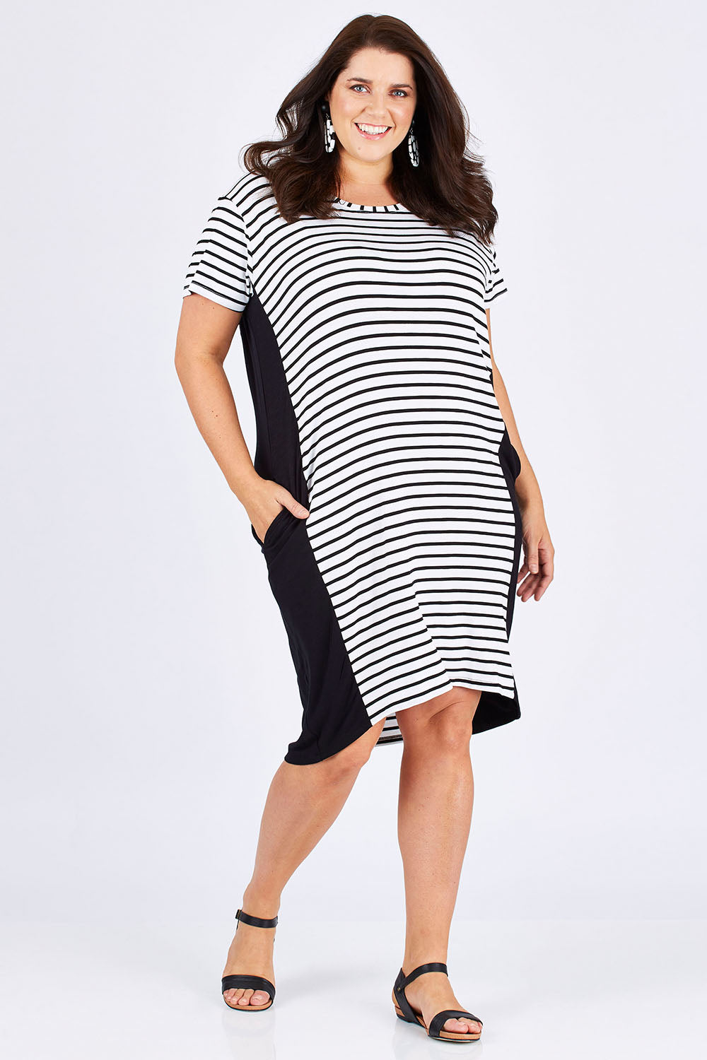 Model Mae wearing size 18 of The Contrast Panel Dress in colour Blkstripe (Black), from the front, showing the whole outfit