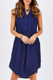 Model Clementine wearing size 10 of The Bonded Cotton Tunic Dress in colour Navy (Blue), from the front, cropped image