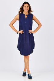 Model Clementine wearing size 10 of The Bonded Cotton Tunic Dress in colour Navy (Blue), from the front, showing the whole outfit