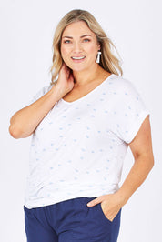 Model Ljubenka wearing size 18 of The Printed V Neck Tee in colour White (White), from the front, cropped image
